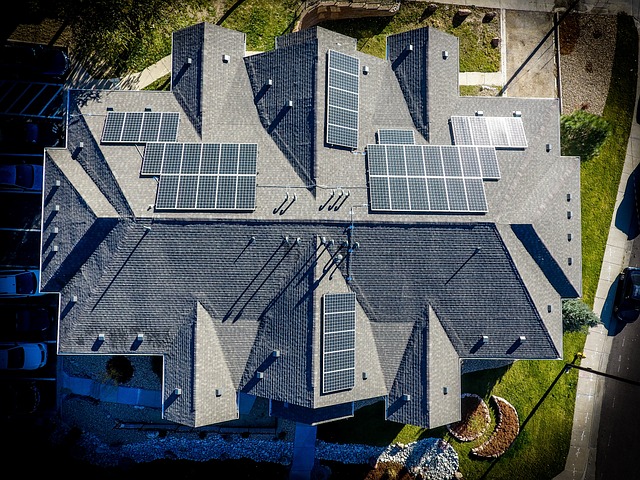 Renewable energy and energy efficiency in action with solar panels on a large house roof.